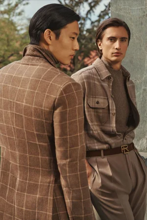 James Turlington and Juhyung Kang wearing neutral plaid tailoring and overshirts for Ralph Lauren Pre-Spring 2024 lookbook.