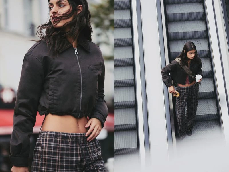 A young woman in a cropped jacket and plaid pants stands outdoors, and on an escalator in different angles. Fashion shoot.