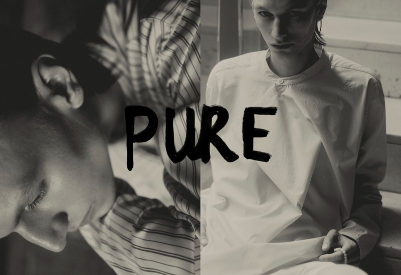Monochrome fashion shot of two young adult models in a split frame featuring one model with eyes closed and the other in white clothing.