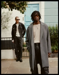 Souleymane Sacko in a grey tailored coat with Nicolas Yoshi outside a London townhouse for Zara.