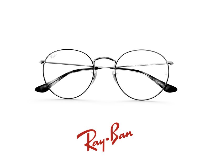 Ray-Ban eyeglasses featuring round silver frames, set against a clean white backdrop, with the brand logo visible at the bottom.
