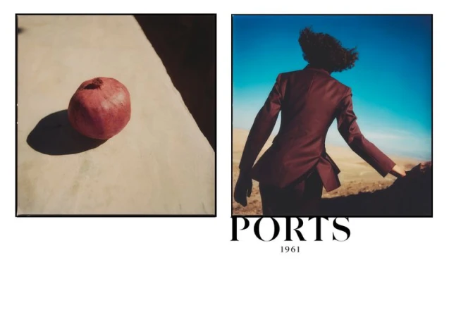 Still life features a pomegranate beside a woman in a red blazer and trousers, showcasing an outdoor fashion editorial.