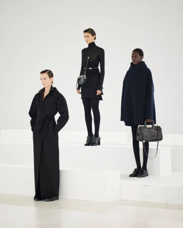 Three female models in black outfits posing on white tiered blocks for Max Mara The Inner Life FW24 campaign by Pier Nicola Bruno