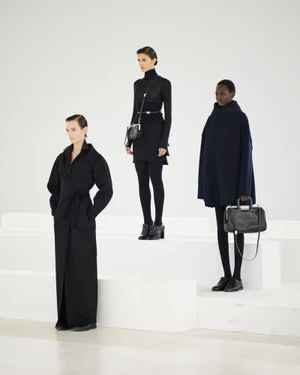 Three female models in black outfits posing on white tiered blocks for Max Mara The Inner Life FW24 campaign by Pier Nicola Bruno
