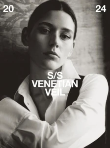 Model in a crisp white shirt with dark vest against a textured background for Massimo Dutti S/S Venetian Veil 2024 campaign.