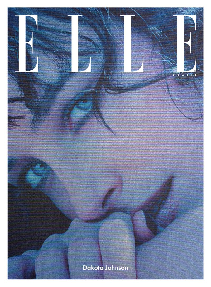 Close-up portrait of Dakota Johnson for Elle Brasil magazine cover with a blue-lavender color grade. She is holding her hand to her mouth.