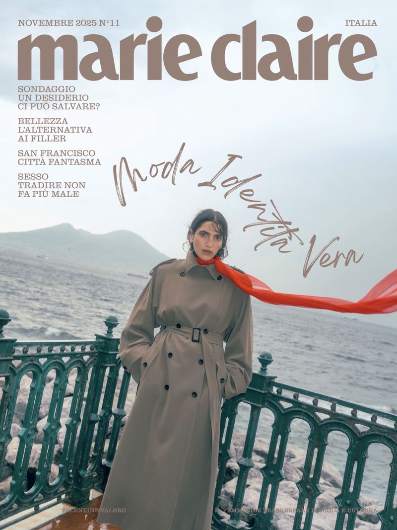 Marie Claire Italia cover featuring a woman in a trench coat with a red scarf against a coastal backdrop, November 2025 issue.
