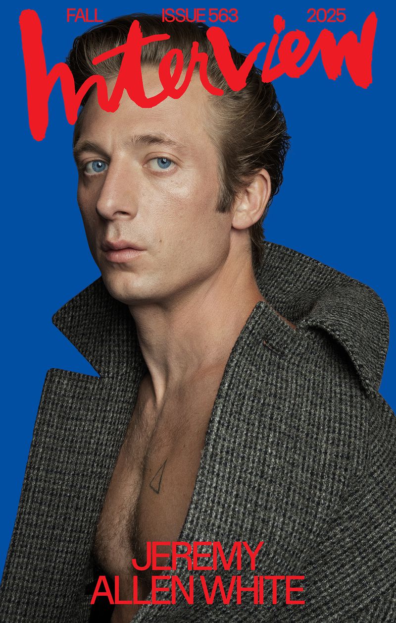Jeremy Allen White on the cover of Interview Magazine, Fall Issue 563, 2025, wearing a gray overcoat against a blue background.