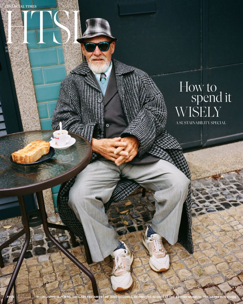 Older man in patterned coat sits at outdoor cafe table with toast and coffee on magazine cover of Financial Times Weekend.