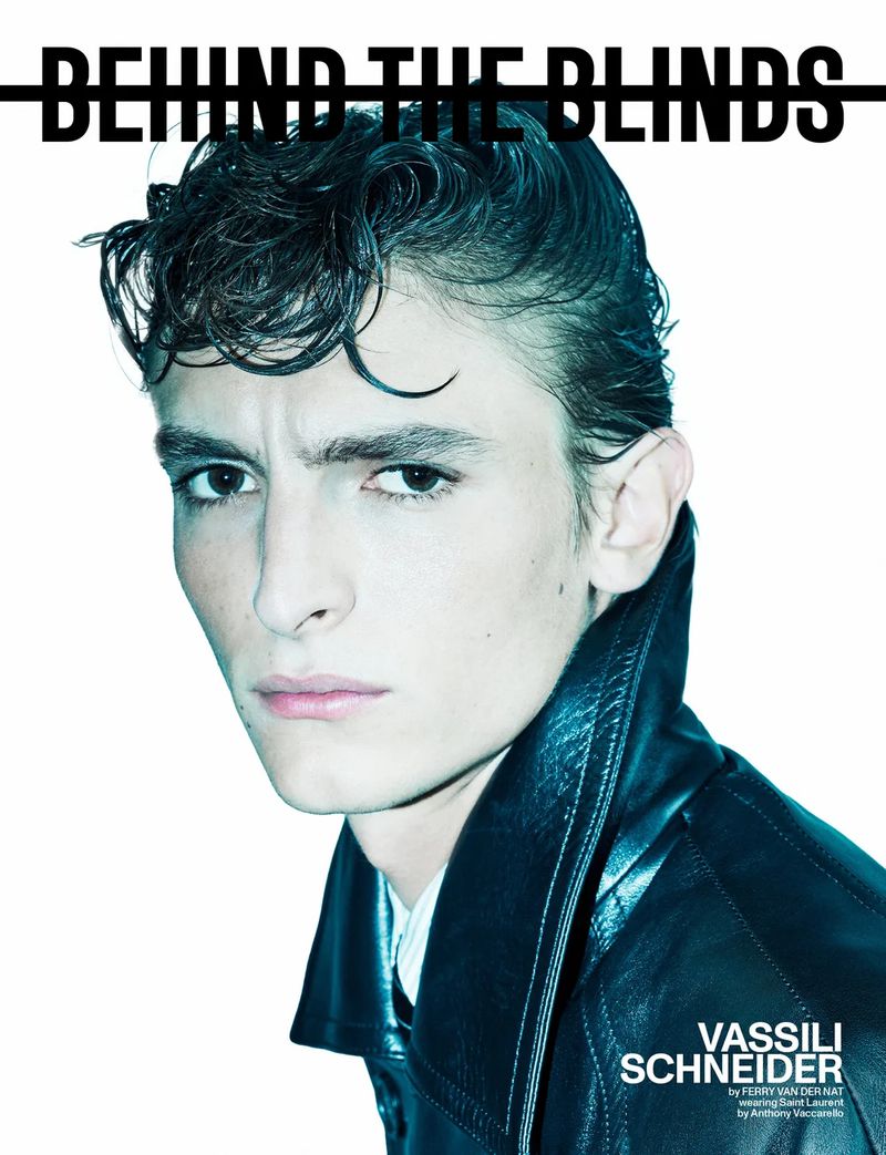 Portrait of Vassili Schneider wearing a dark leather jacket against a white background for Behind the Blinds