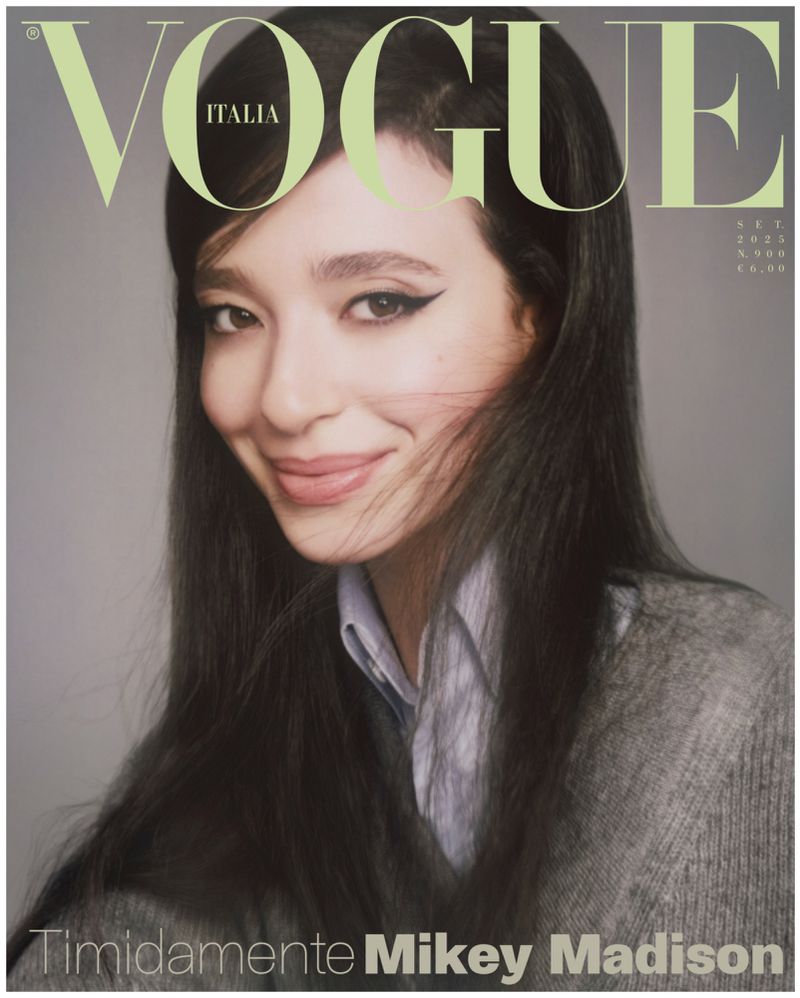 Vogue Italia magazine cover featuring Mikey Madison, Sept 2023 issue. Close-up of smiling young woman with long dark hair and gray sweater.