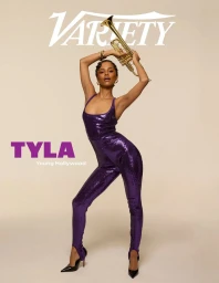 Tyla posing in a sparkly purple jumpsuit holding a gold trumpet against a neutral background for Variety Magazine