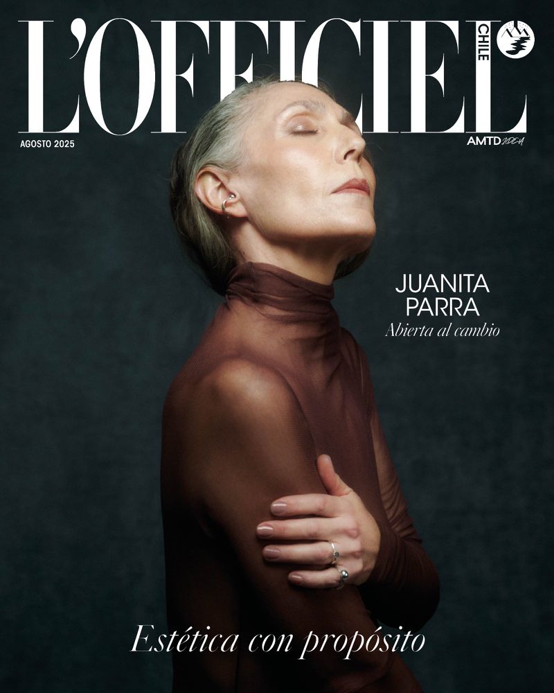 Magazine cover featuring a serene older woman with closed eyes, wearing a brown top and jewelry, against a dark background.