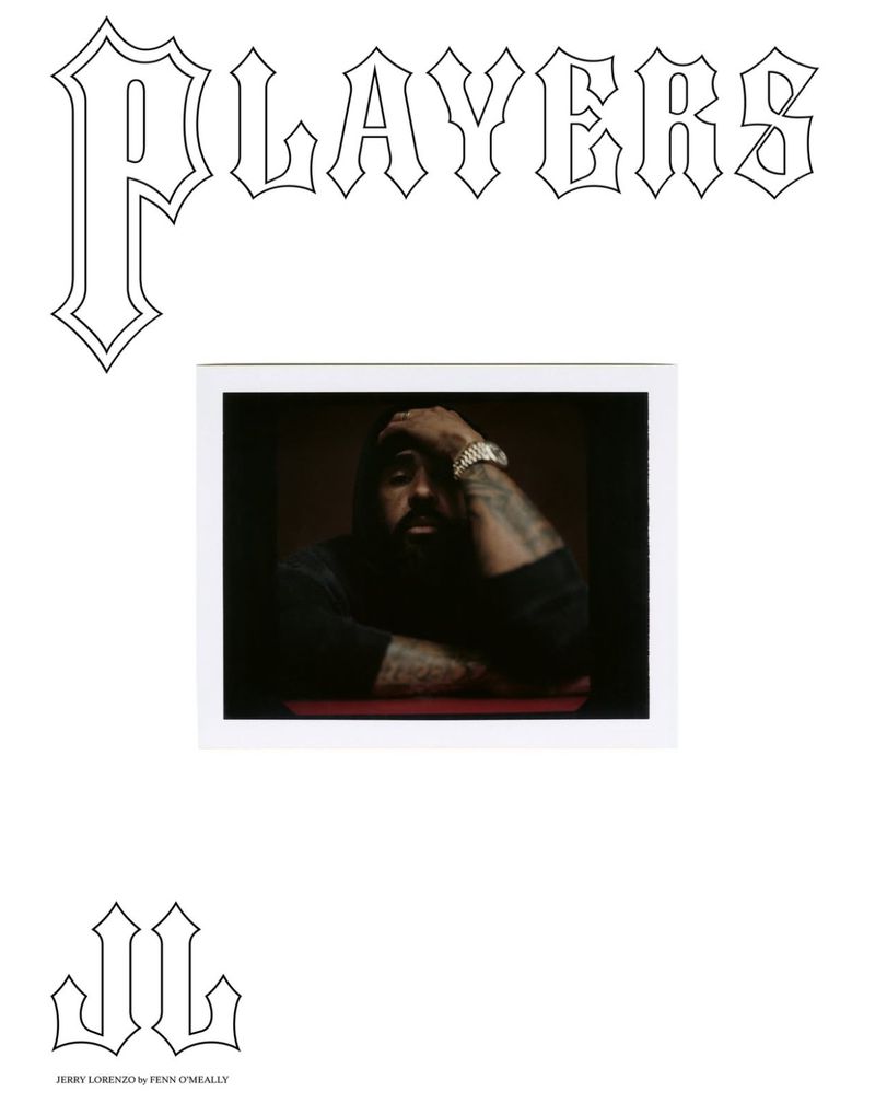 Portrait of an adult male with a beard and tattoos wearing a watch. The image is framed in a photo and placed on white.