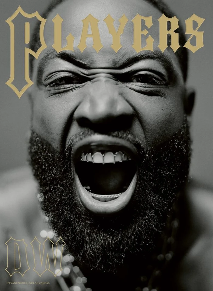 Close-up black and white portrait of a man shouting with grills on his teeth for Players magazine cover.