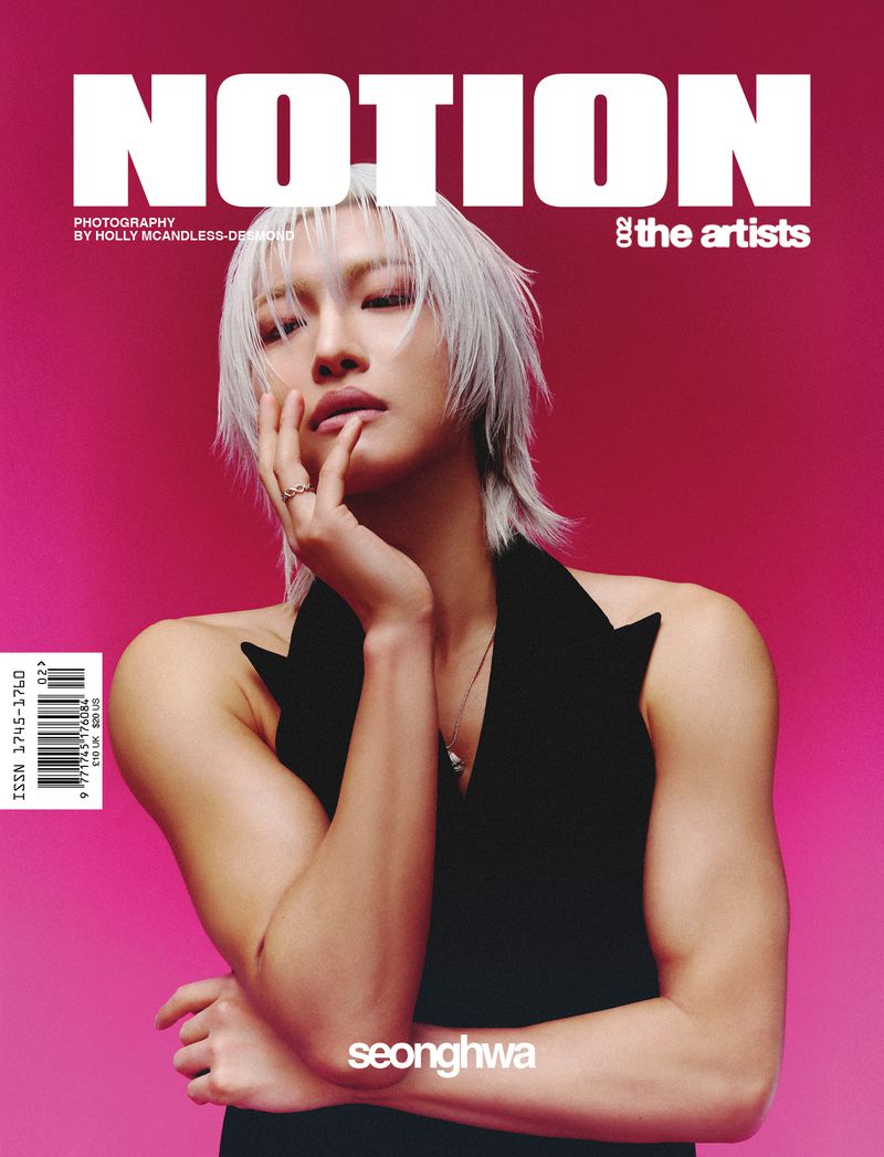 Magazine cover featuring Seonghwa with white hair, wearing a black top, posing against a pink background, with magazine text.