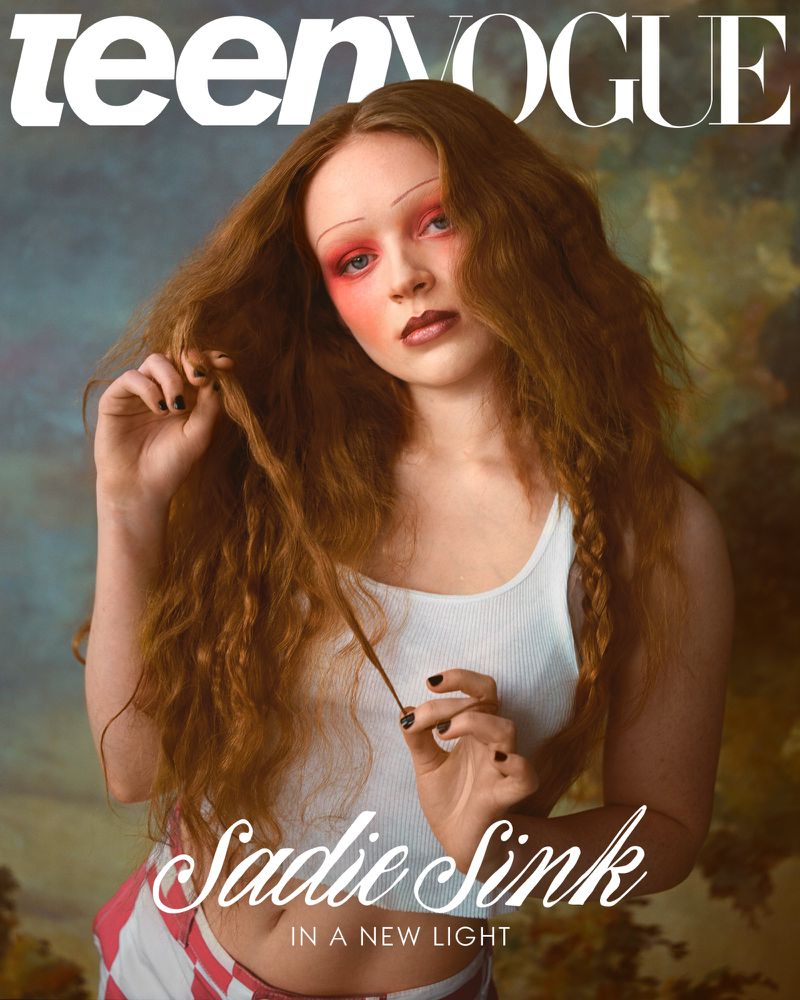 Teen Vogue magazine cover featuring Sadie Sink with red hair, wearing a white tank top, and posing in front of an art background.