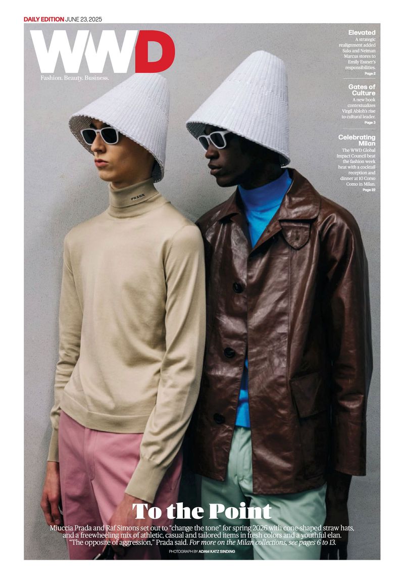 Two fashion models wearing cone hats and sunglasses on a WWD cover, one in a brown leather jacket, the other in a beige turtleneck.