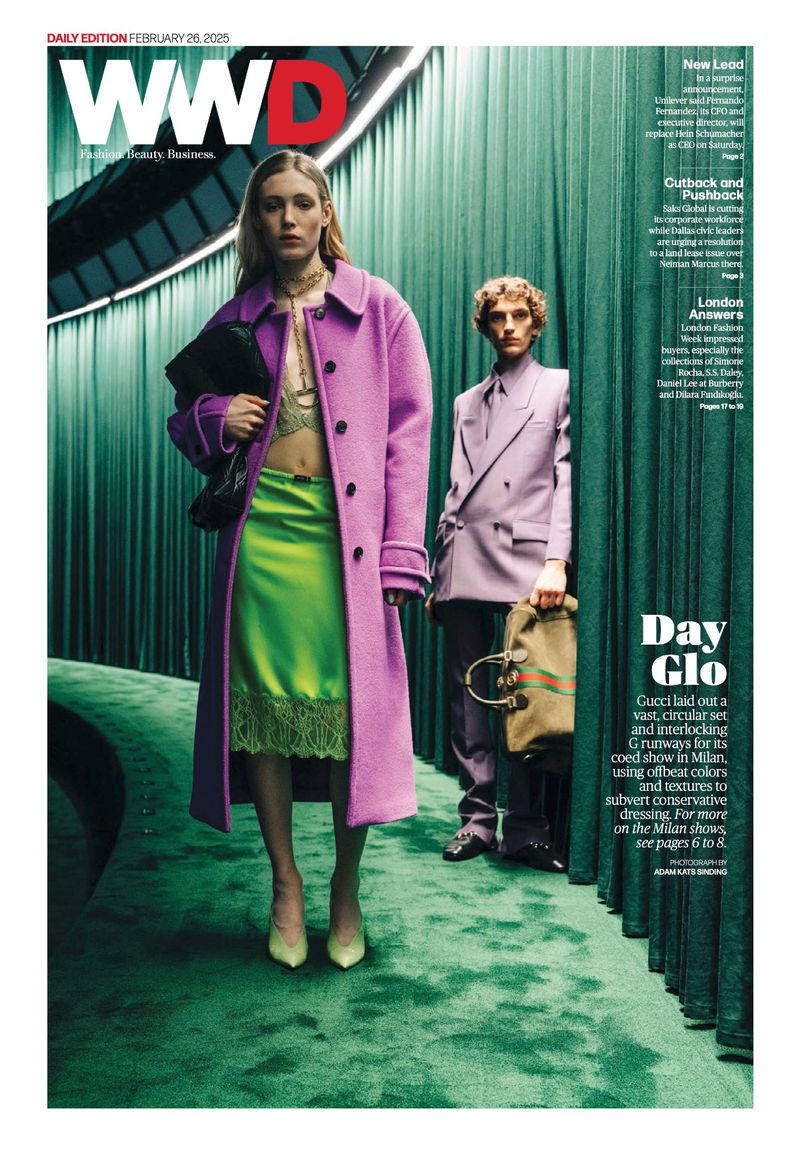 Fashion magazine cover with two models in lavender and green outfits against a green backdrop, featuring the WWD logo and text.