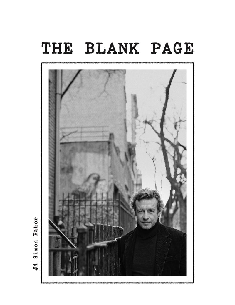 Black and white magazine cover featuring actor Simon Baker outdoors in front of a building and bare trees, with the title 'The Blank Page'.