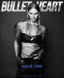 Model Julia Schneider in black sheer top and trousers wearing statement chain necklace for Bulletheart April 2025