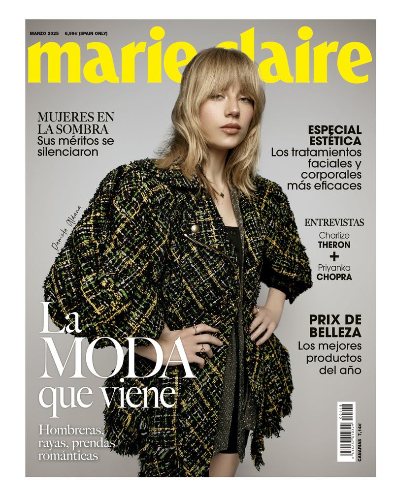 Marie Claire magazine cover featuring a blonde woman wearing a patterned jacket, against a backdrop of magazine text elements.
