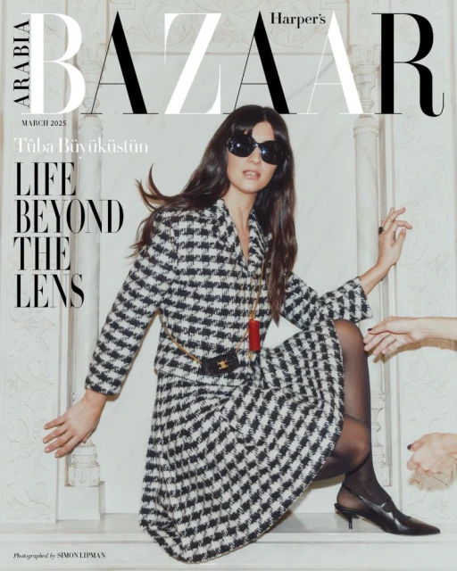Harper's Bazaar Arabia March 2025 cover featuring Tuba Büyüküstün in a patterned skirt suit with sunglasses, styled by Simon Lipman.