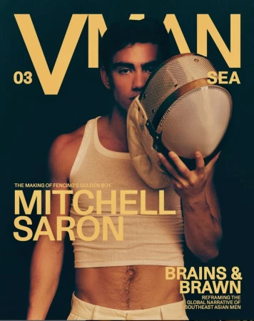 Mitchell Saron posing with a fencing mask in a white cropped tank top on the cover of V Man SEA issue 03.