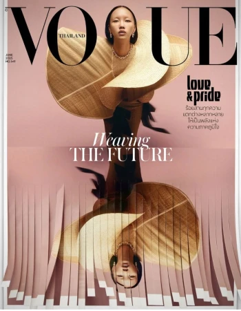 Vogue Thailand cover featuring an Asian woman wearing a straw hat and dress with paper fringe trim in a vertical portrait orientation.