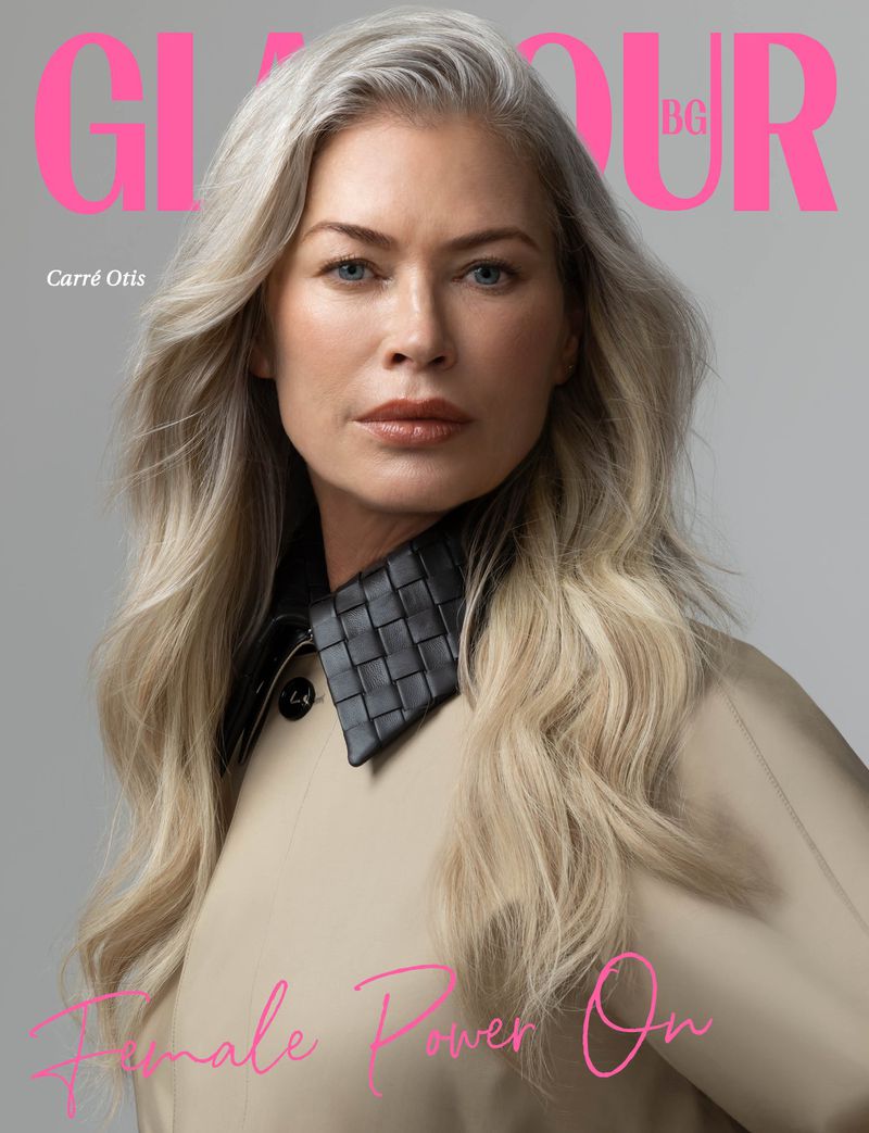 Close-up portrait of Carre Otis on a Glamour BG cover, featuring a beige coat with a black woven collar against a grey background.