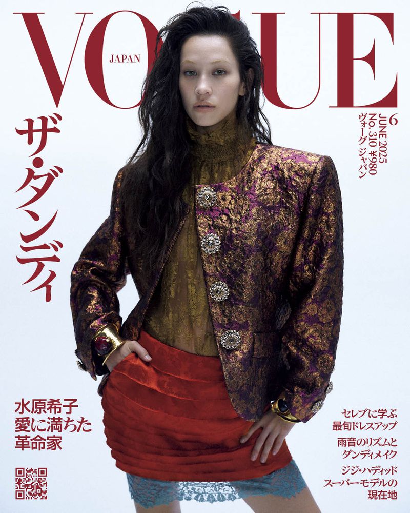 Vogue Japan cover featuring a model in a gold and purple brocade jacket and red skirt, with the magazine's title and Japanese text.