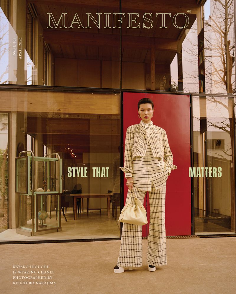 Fashion editorial featuring a stylish Asian woman in plaid suit, holding a white handbag, standing in front of a modern building.