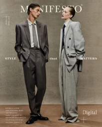 Konrad Bauer and Viktoria Wirs wearing tailored Saint Laurent suits on the cover of Manifesto Magazine.