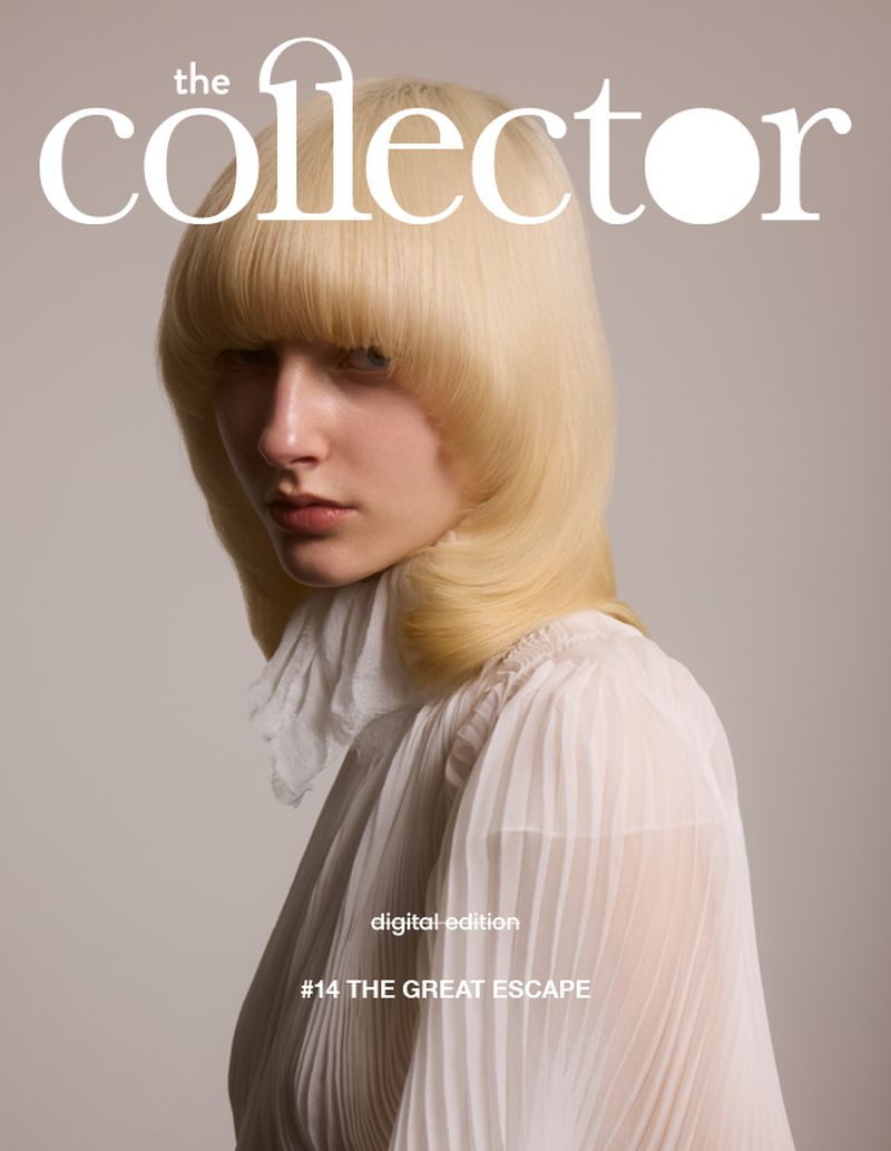 Fashion magazine cover featuring a portrait of a young adult woman with blonde hair and wearing a white dress against a neutral background.