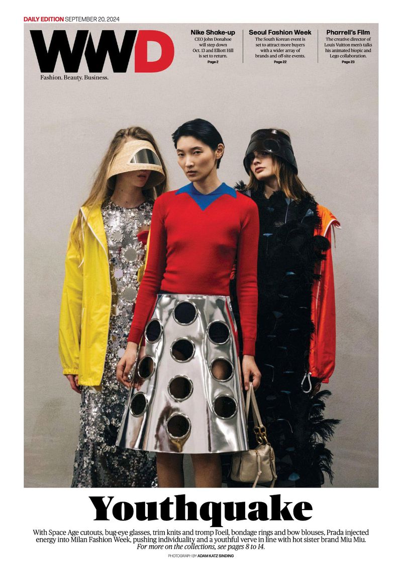 WWD magazine cover featuring three fashion models wearing unique designs, showcasing avant-garde style in an indoor setting.