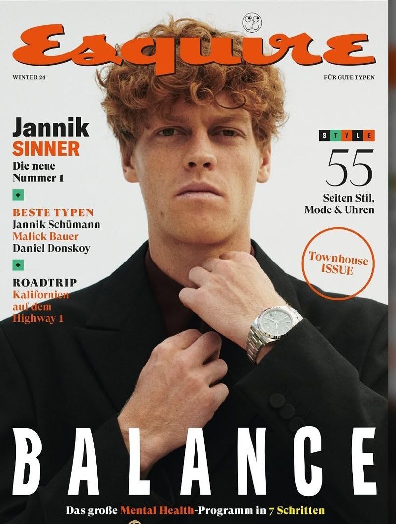 Esquire magazine cover featuring Jannik Sinner in a black suit, captured in a medium shot with a focus on his portrait and fashion elements.