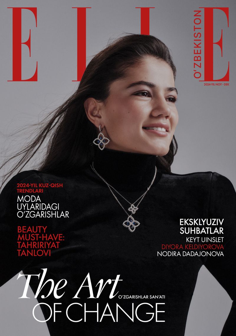 Diyora Keldiyorova smiling in a black turtleneck and diamond flower jewelry on the cover of Elle Uzbekistan.