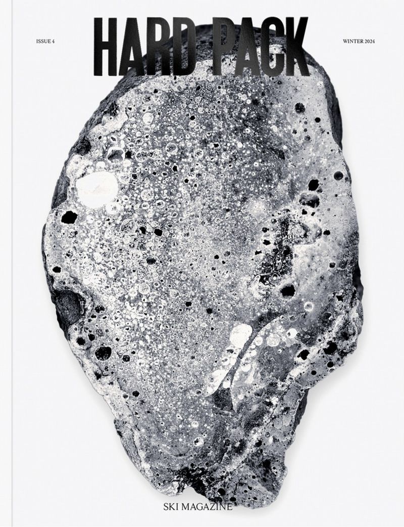 Ski magazine cover featuring a close-up of a grey and white rock. The title of the magazine, Hard Pack, is shown at the top.
