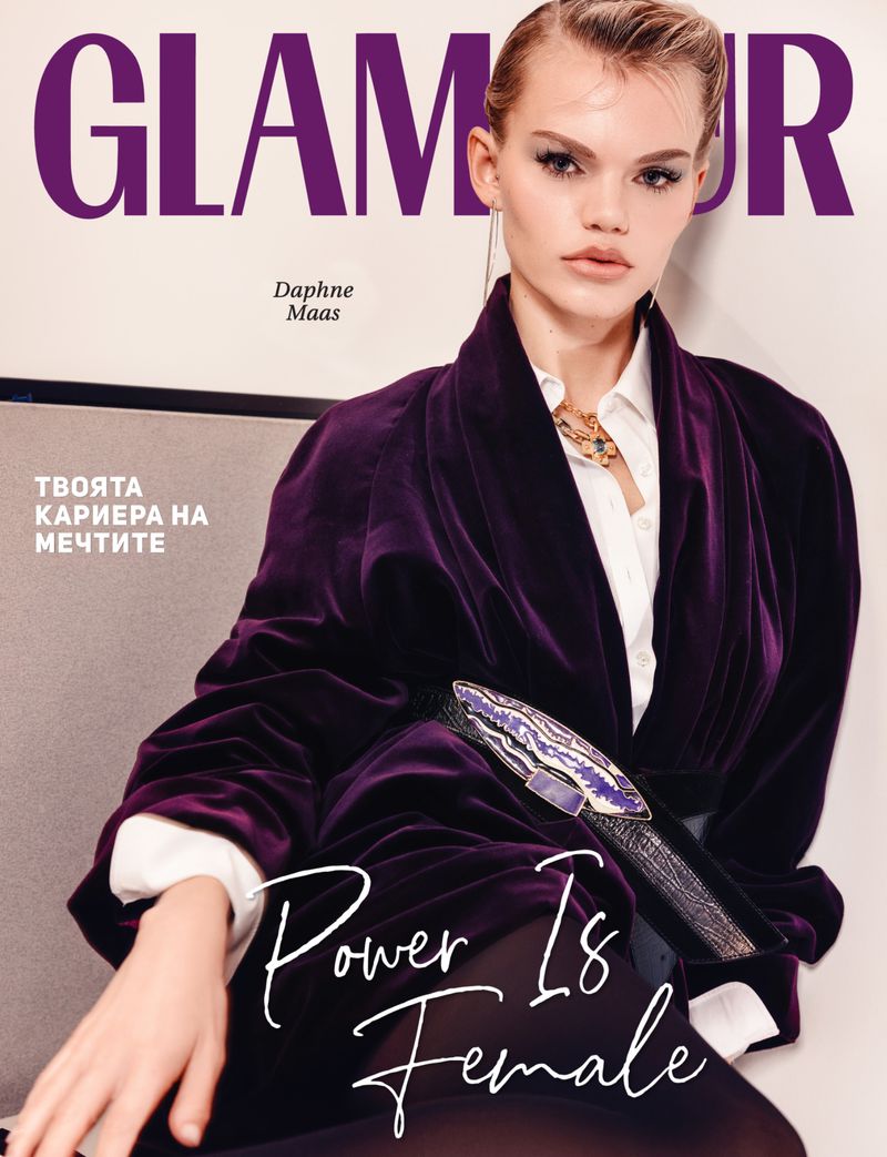 Glamour magazine cover featuring Daphne Maas in purple velvet jacket and belt with statement buckle, against a light beige background.