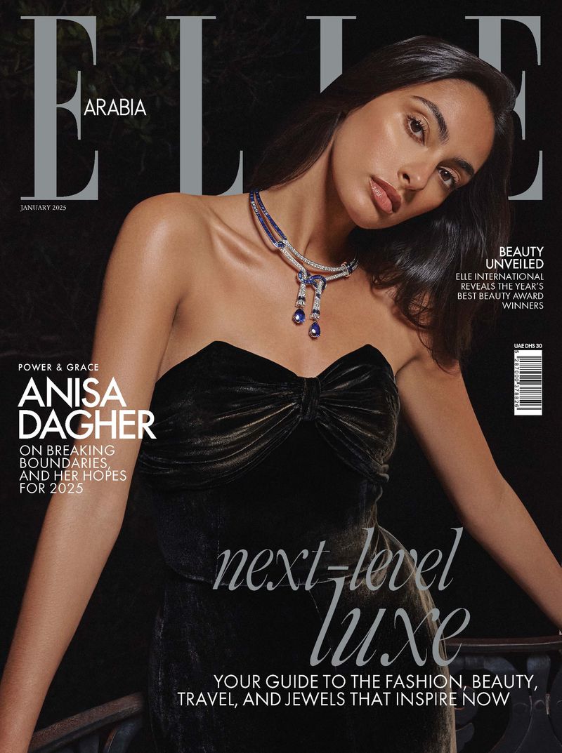 Elle Arabia magazine cover featuring model Anisa Dagher, wearing a velvet dress and statement jewelry, in a softly lit, elegant setting.