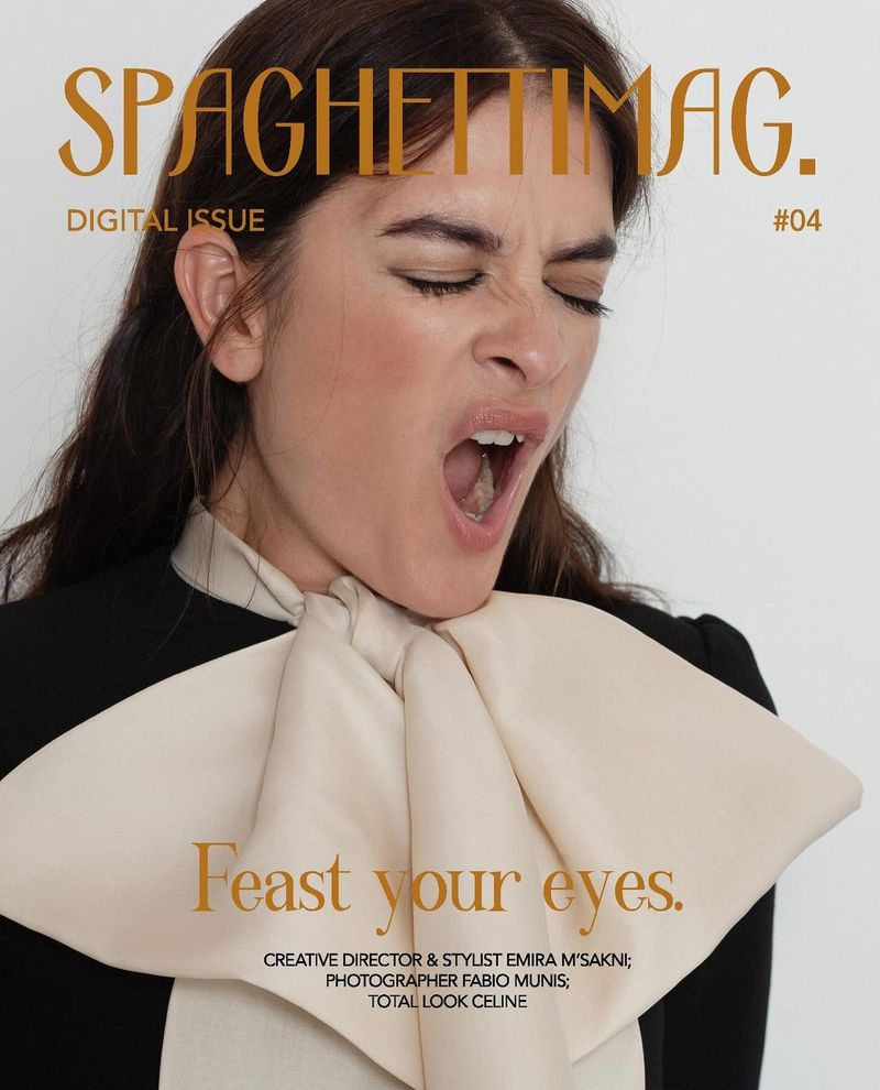 Magazine cover featuring a woman in a black and cream dress with open mouth, against a neutral backdrop and Spaghetti Mag logo.