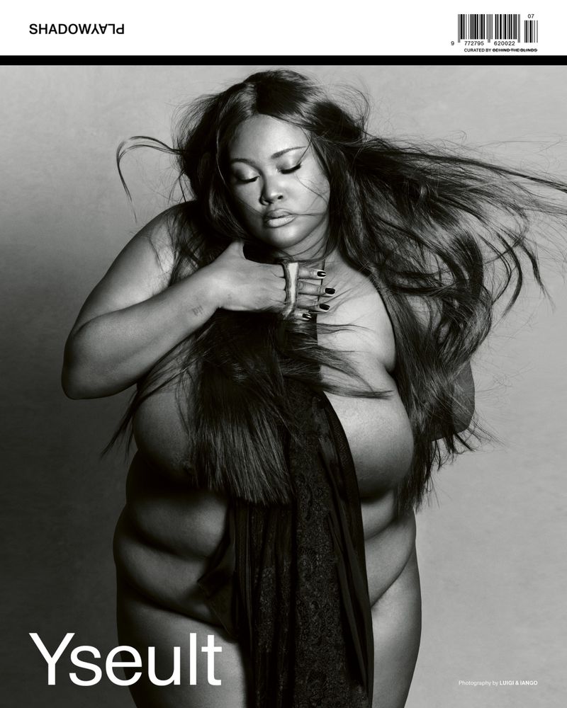 Monochrome close-up of an adult woman with long hair, draped in fabric on a grey background for a Shadoways magazine cover.