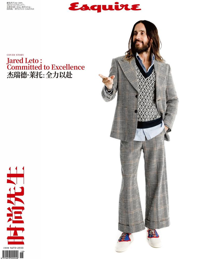 Esquire magazine cover featuring Jared Leto wearing a grey plaid suit, posing against a white backdrop with the magazine's text overlaid.