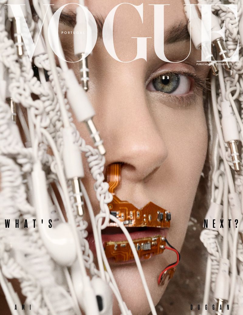 Vogue Portugal cover featuring a close-up of a woman's face adorned with white headphones and computer hardware, creating a futuristic and tech-focused aesthetic.