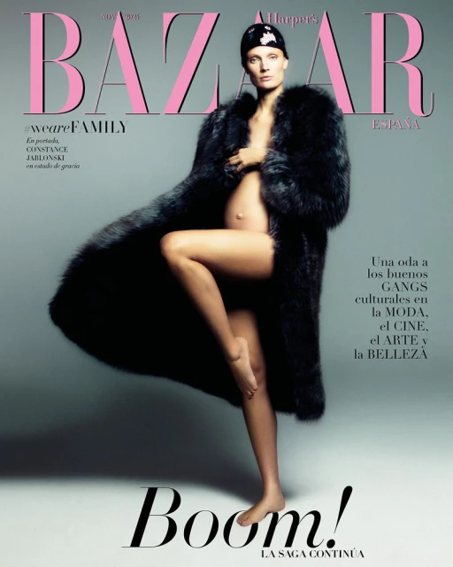 Magazine cover featuring a pregnant Constance Jablonski in a dark fur coat and head covering, posing in front of a light grey background.