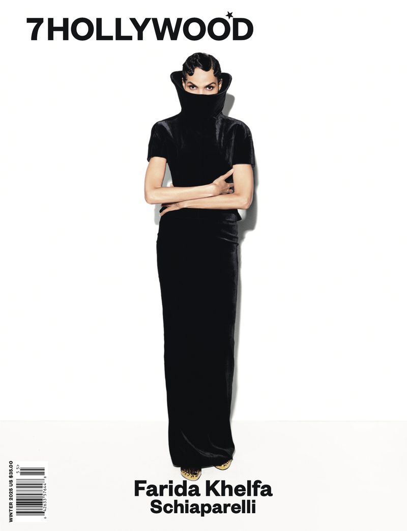 Fashion magazine cover featuring Farida Khelfa in black gown with high neck, posing against a white background, '7 Hollywood' logo.