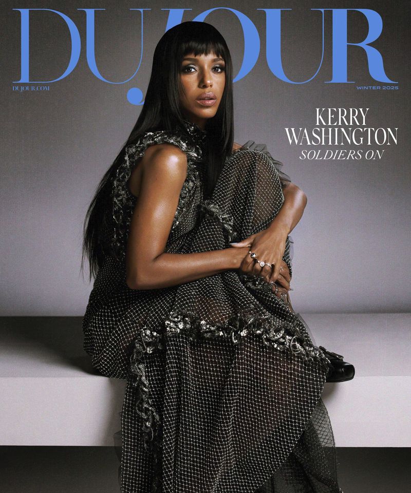 Magazine cover featuring Kerry Washington in a sheer black dress sitting against a grey background with blue magazine masthead.