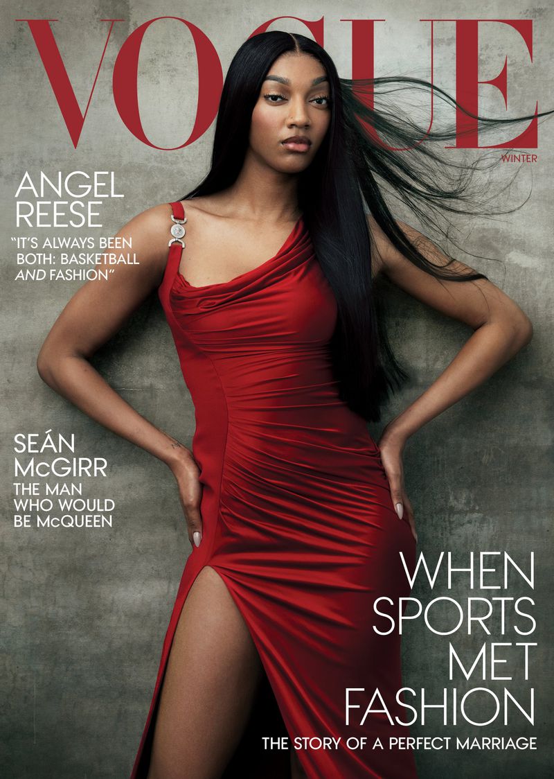 Vogue cover featuring Angel Reese in a red dress with a thigh-high slit, posing against a textured gray background, with magazine text.