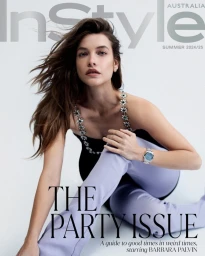 Model Barbara Palvin wearing lilac pants and black top seated against a white background for InStyle Australia