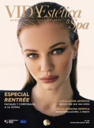 Close-up portrait of a woman with slicked-back hair and neutral makeup featured on a magazine cover with overlay text.